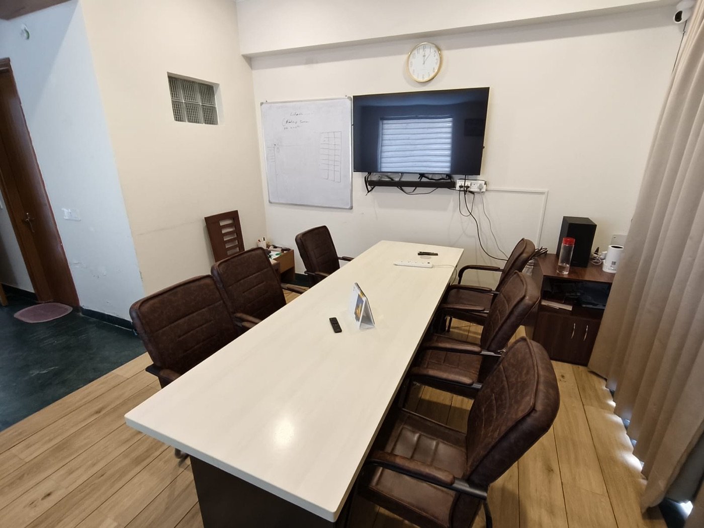 Conference Room — whiteboard & TV setup